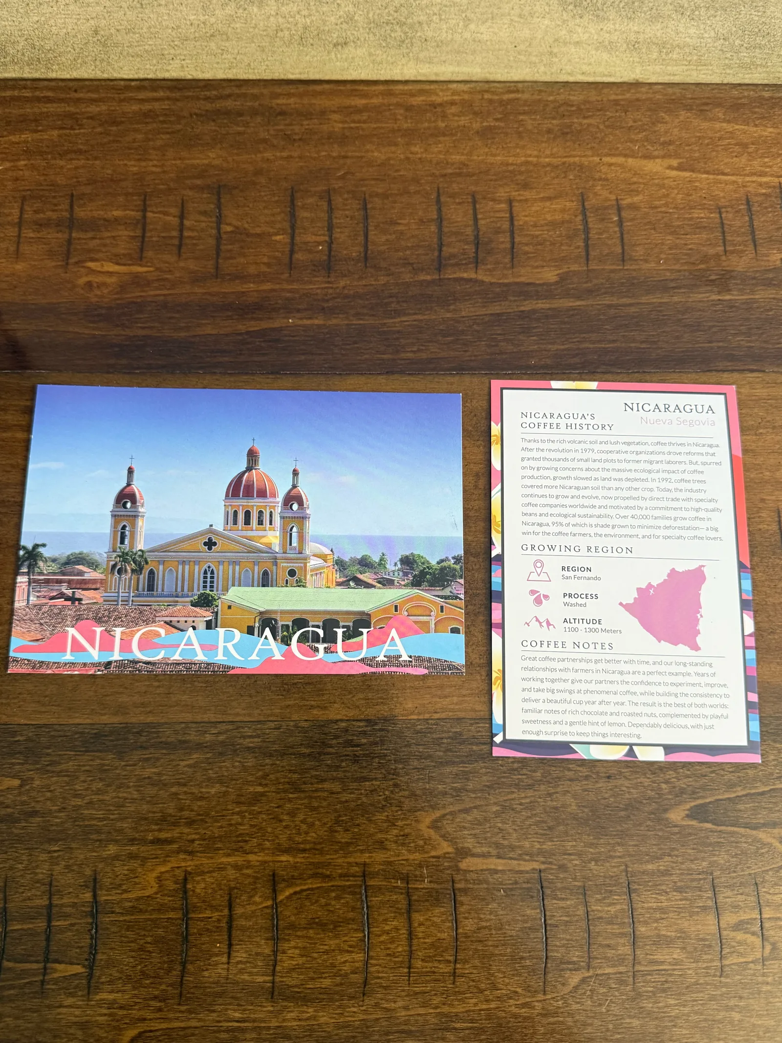 Nicaragua postcard showing a yellow cathedral, next to Atlas's origin card with region, process, altitude and coffee notes