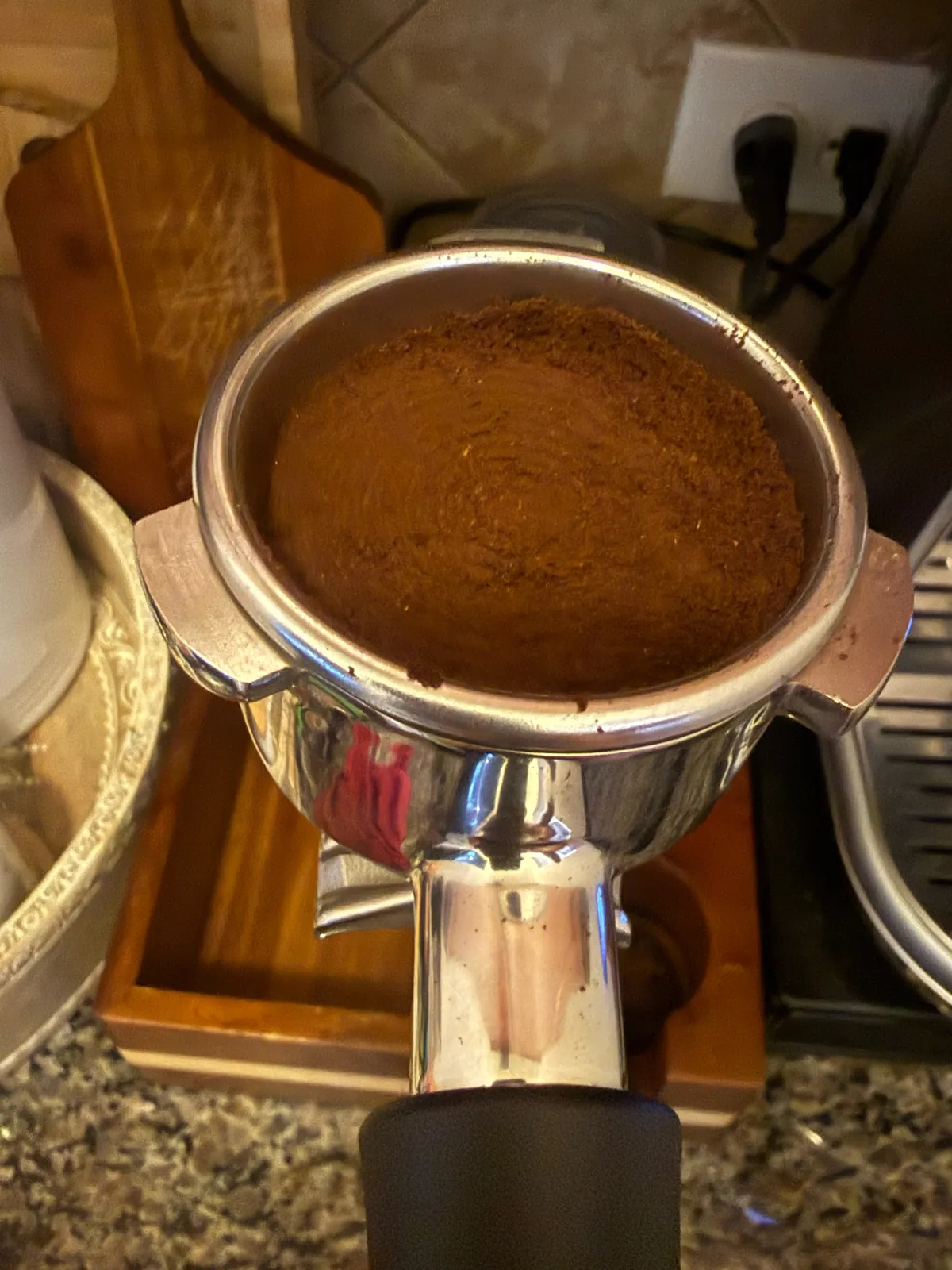 Portafilter filled with ground Volcanica coffee
